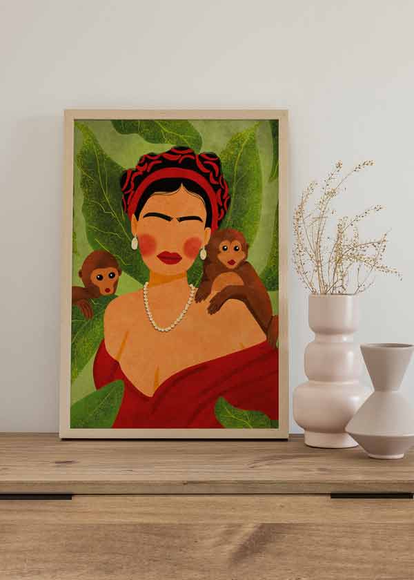 Cuadro de ilustración de Frida Kalho sobre con monos sobre fondo verde y motivos florales